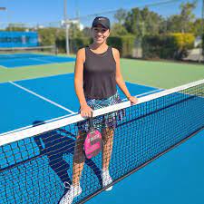 Woman on a sunny tennis court