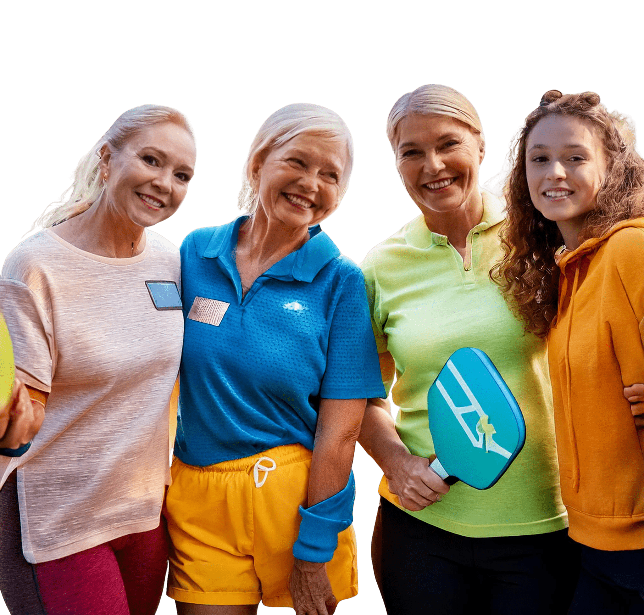 Group of women with pickleball gear smiling together.